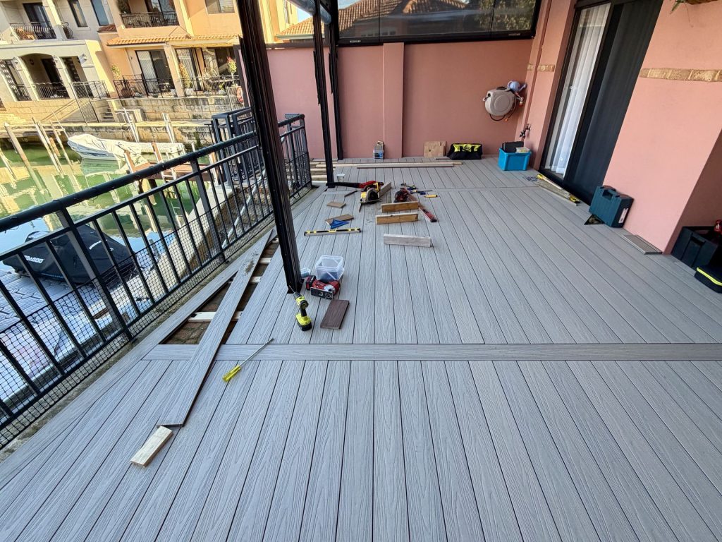 Composite decking installation on a canal-side balcony in Mandurah