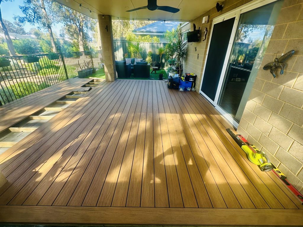 Split-level composite alfresco deck with a step down being installed in Mandurah
