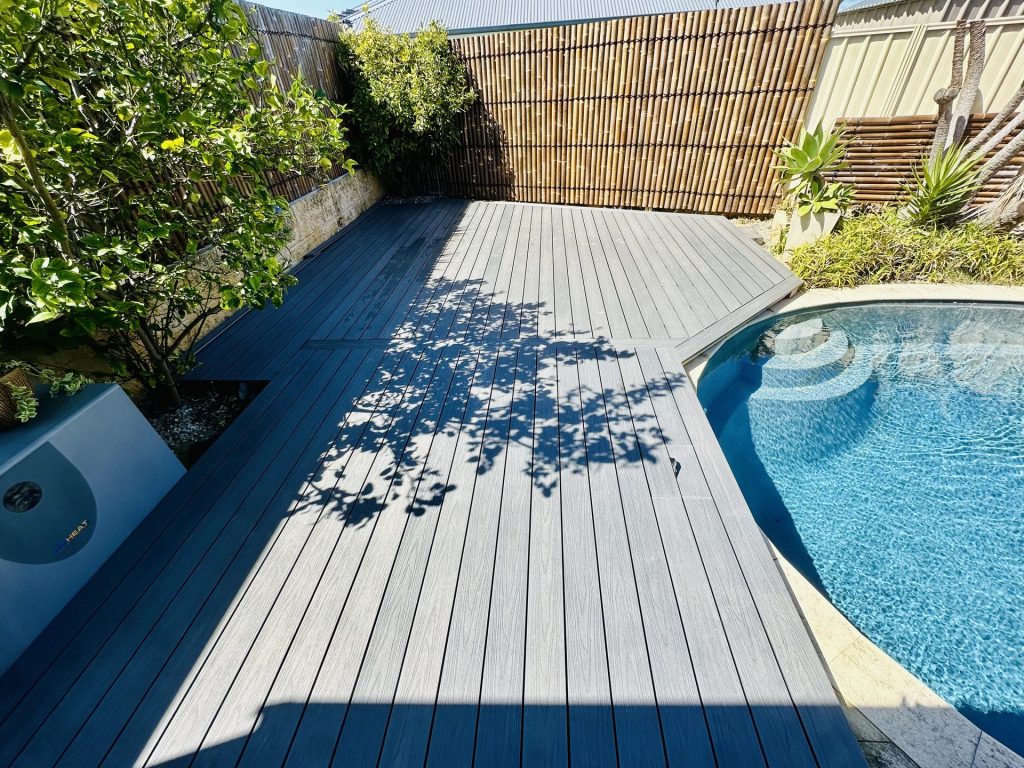 Grey composite pool deck with a curved edge following the pool in Mandurah